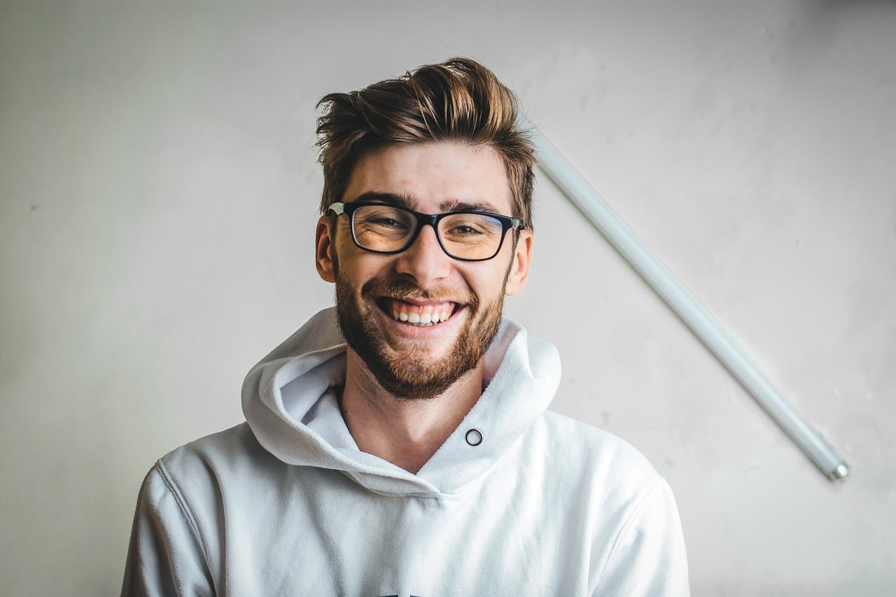 man free from depression smiling at the camera